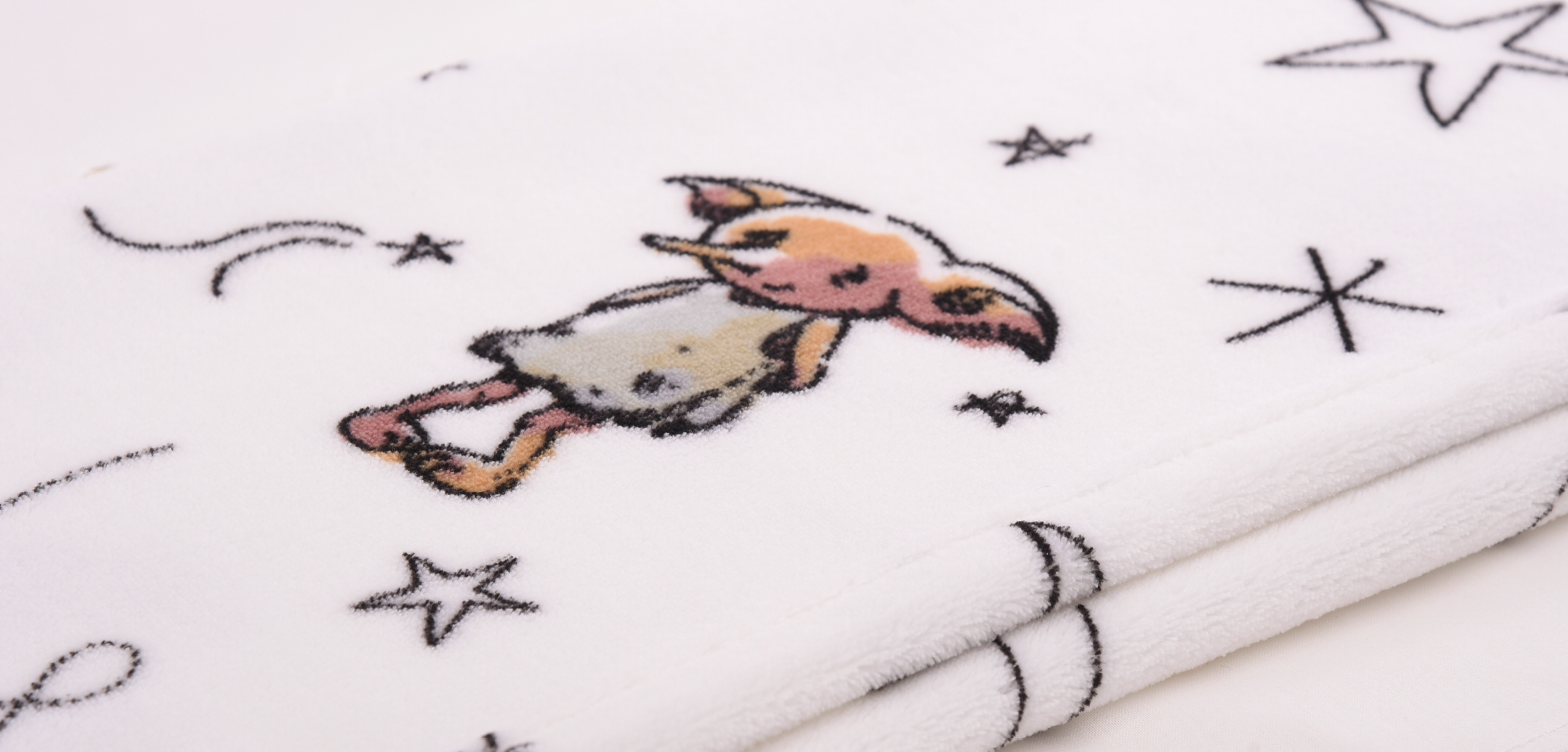 Eine Nahaufnahme einer Decke aus unseren Baby Textilien.